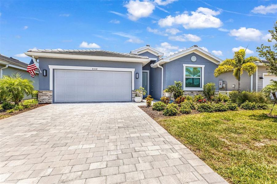 Front exterior of a new home in , Englewood, FL, highlighting curb appeal (Image 23).