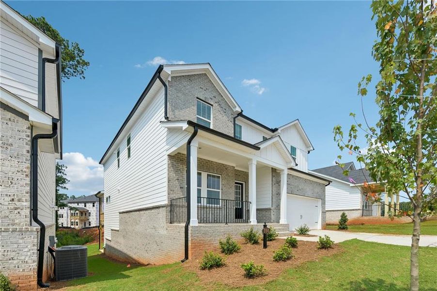 Exterior details and patio area of a home in Martin Springs - Estate Series, Lawrenceville (Image 3).