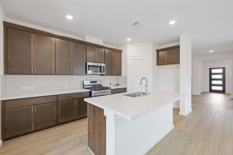Furnished interior view inside a new home in Sunterra, Katy (Image 10).