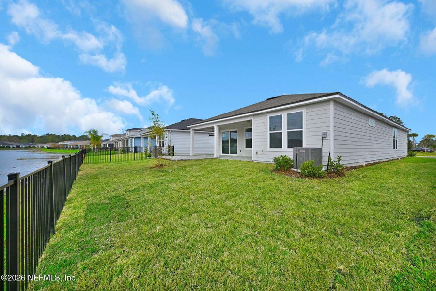 Exterior details and patio area of a home in Summer Bay at Grand Oaks, St. Augustine (Image 25).