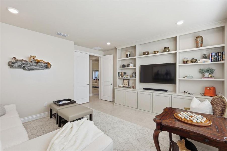 Living room featuring recessed lighting and light tile patterned flooring
