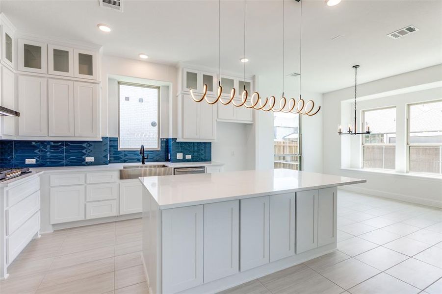 Quartz countertops, cabinets to ceiling