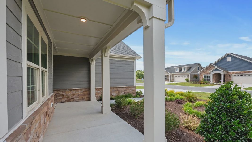 Exterior details and patio area of a home in Courtyards by Carrell, Ocean Isle Beach (Image 22). Exterior details and patio area of a home in Courtyards by Carrell, Ocean Isle Beach (Image 22).