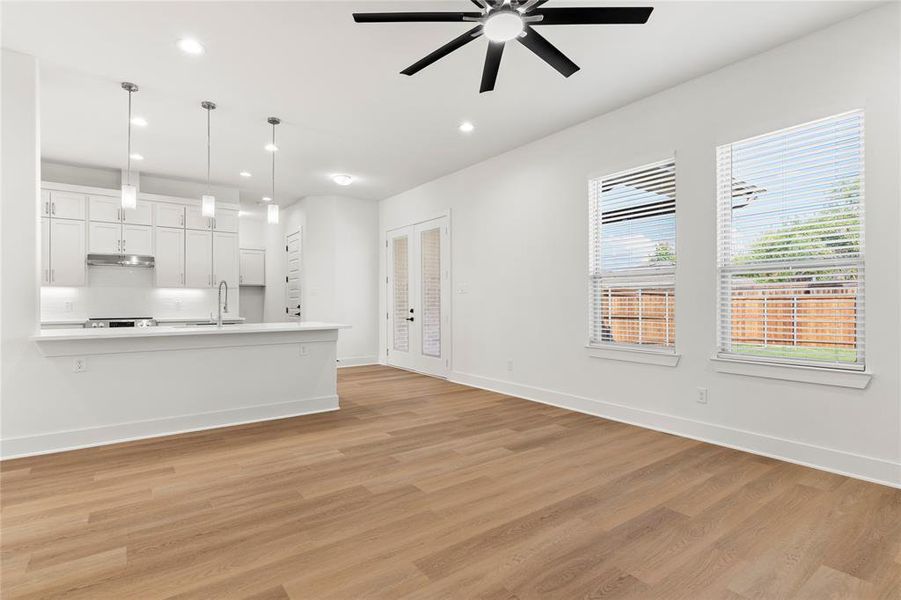 Unfurnished living room featuring light wood-style floors, recessed lighting, and ceiling fan Unfurnished living room featuring light wood-style floors, recessed lighting, and ceiling fan