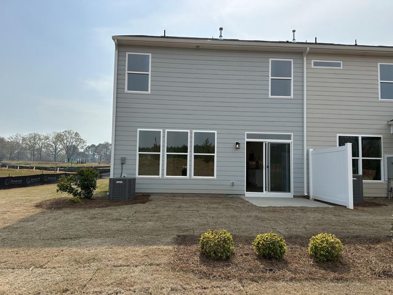 Exterior details and patio area of a home in Blythe Mill Townhomes, Waxhaw (Image 3).