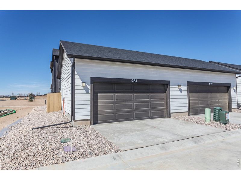 Exterior details and patio area of a home in Prairie Song Story Collection - Single Family Homes, Windsor (Image 25).