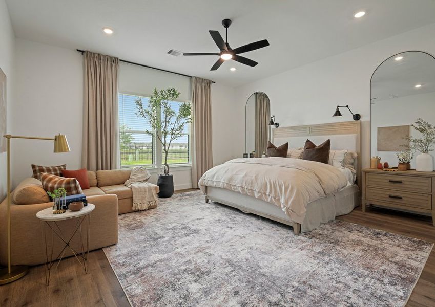 Relax in the private primary bedroom. Relax in the private primary bedroom.