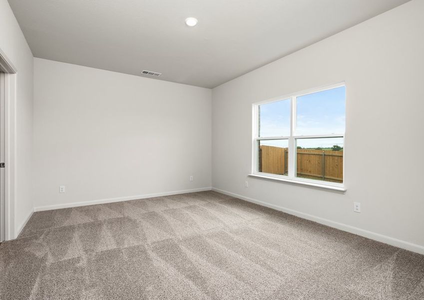 The master bathroom has a large window that lets in great, natural light.