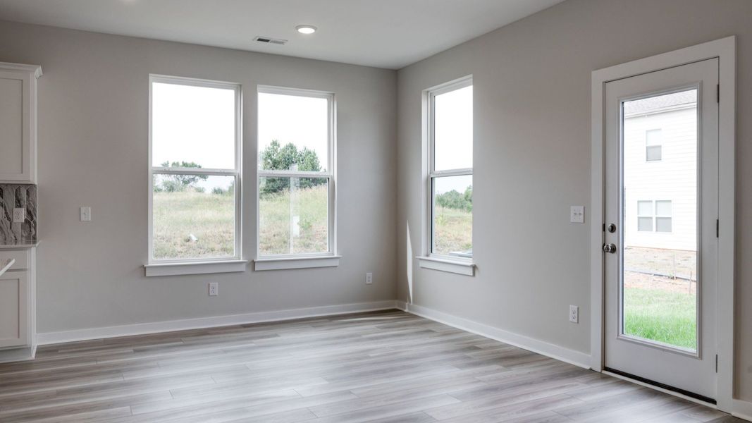 Back door next to kitchen and dining area