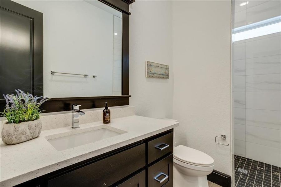Bathroom featuring vanity and a stall shower