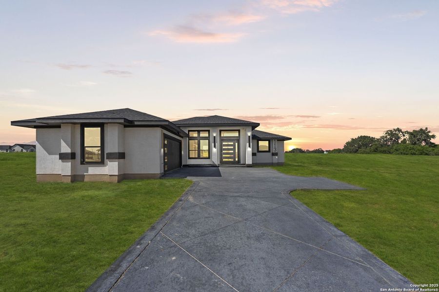 Front exterior of a new home in , Floresville, TX, highlighting curb appeal (Image 26). Front exterior of a new home in , Floresville, TX, highlighting curb appeal (Image 26).