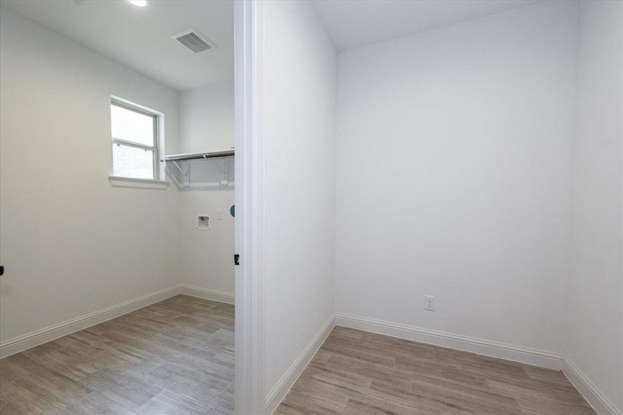 Spacious Laundry Room! Big enough to add shelves and design it at your like