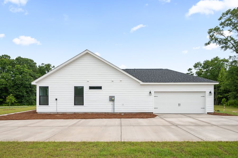 Representative exterior photo of a completed home built from the Fischer by Hunter Quinn Homes in Beaufort County Homes, Beaufort, SC (Image 23). Representative exterior photo of a completed home built from the Fischer by Hunter Quinn Homes in Beaufort County Homes, Beaufort, SC (Image 23).