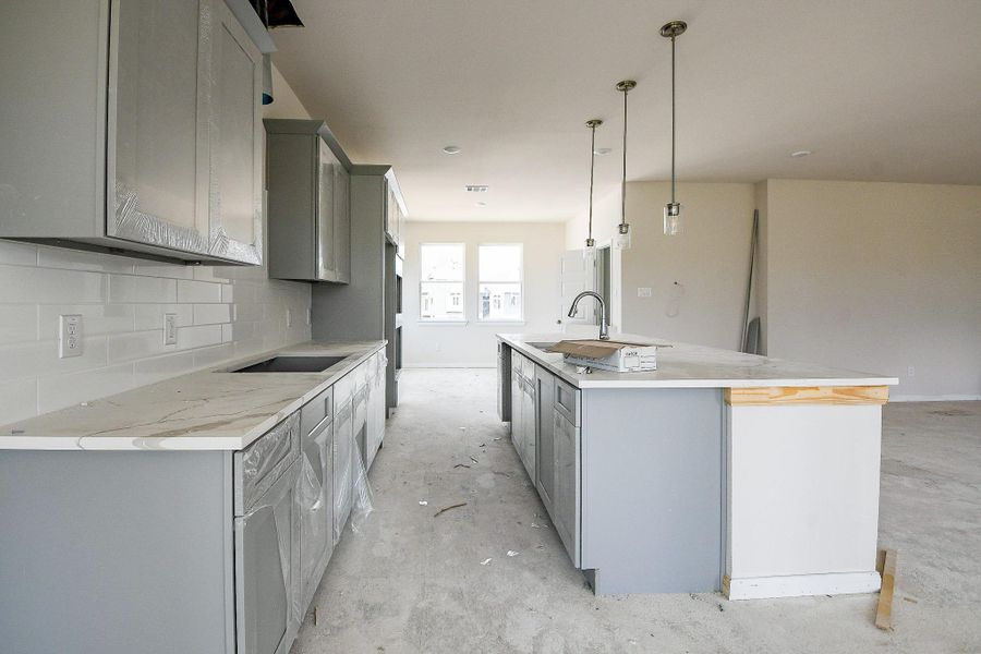 Notice the expansive island countertops. Notice the expansive island countertops.