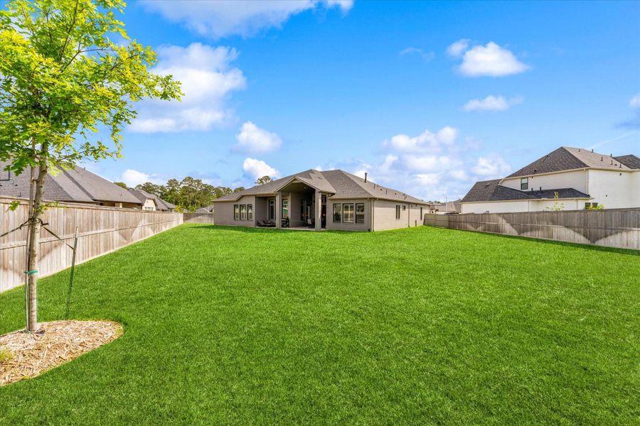 The oversized backyard offers endless possibilities for creating your dream outdoor oasis.