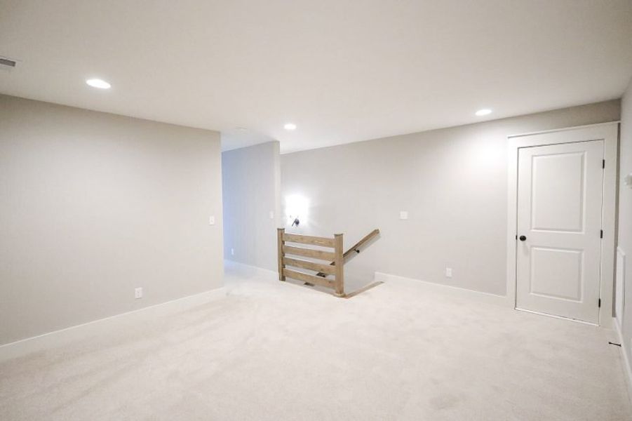 Spacious, unfurnished interior of a new home in Baker Road, Birchwood (Image 67).