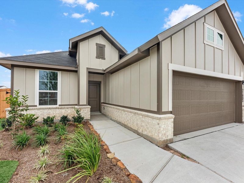 Front exterior of a new home in Mason Woods, Cypress, TX, highlighting curb appeal (Image 15).