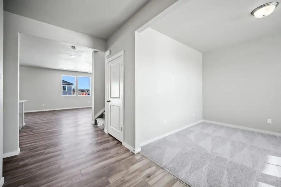 Spacious, unfurnished interior of a new home in The Glen, Colorado Springs (Image 11).