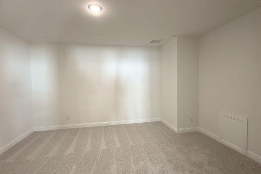 An inviting atmosphere fills this well-lit room, ready for your personalized touch.