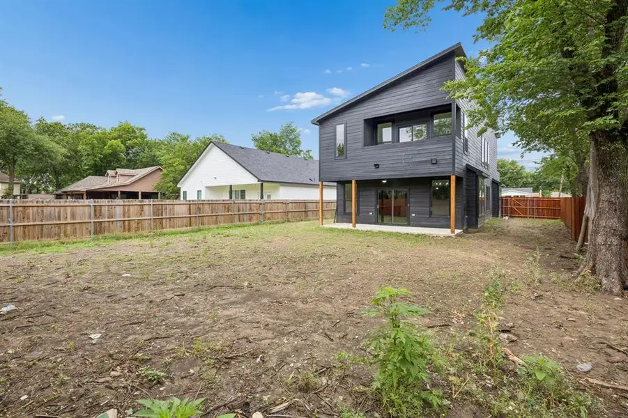 Contemporary two-story residence featuring dark horizontal siding and a striking angled roofline Contemporary two-story residence featuring dark horizontal siding and a striking angled roofline