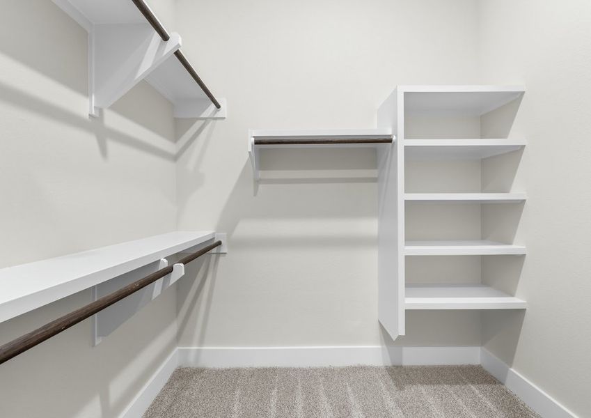 The walk-in, master closet has plenty of hanging and shelf space.