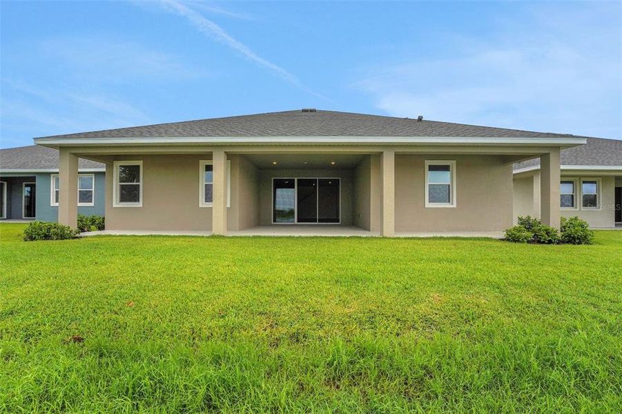 Front exterior of a new home in Seaire, Parrish, FL, highlighting curb appeal (Image 21).
