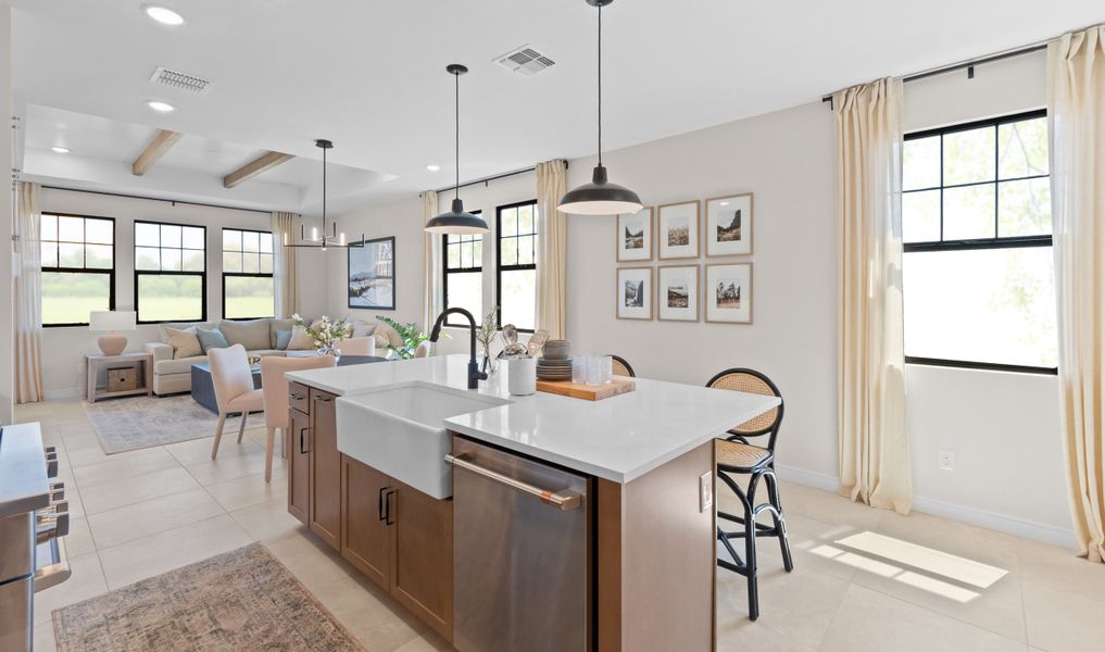 Kitchen with spacious island and natural light Kitchen with spacious island and natural light