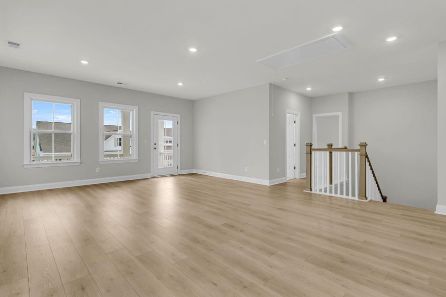 Spacious, unfurnished interior of a new home in Tidewater at Lakes of Cane Bay, Summerville (Image 36).