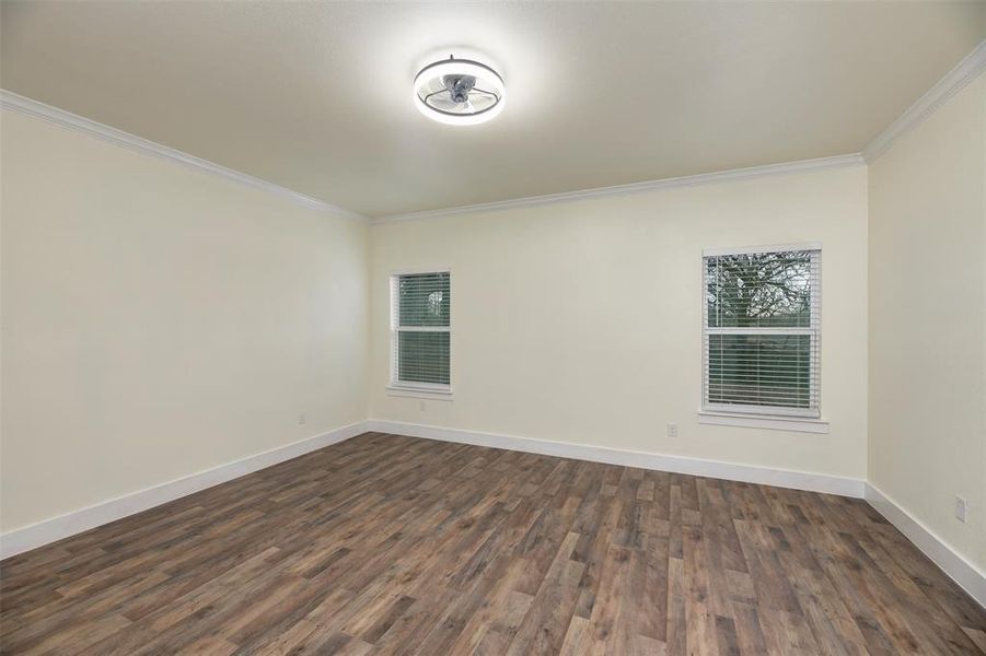 2 inch mini blinds included throughout. Crown molding and ceiling fan in primary bedroom.