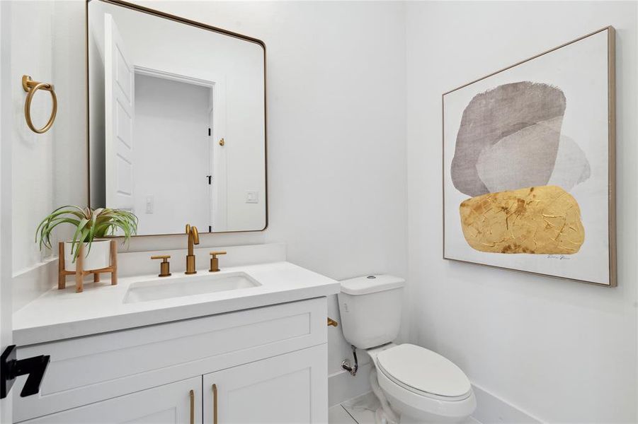 A chic powder room with contemporary finishes and bold design.