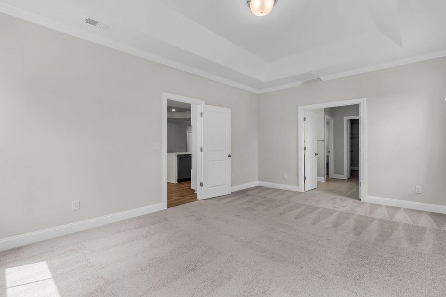 Spacious, unfurnished interior of a new home in Tidewater at Lakes of Cane Bay, Summerville (Image 29).