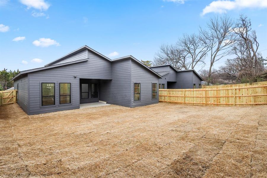 Back of house with a patio