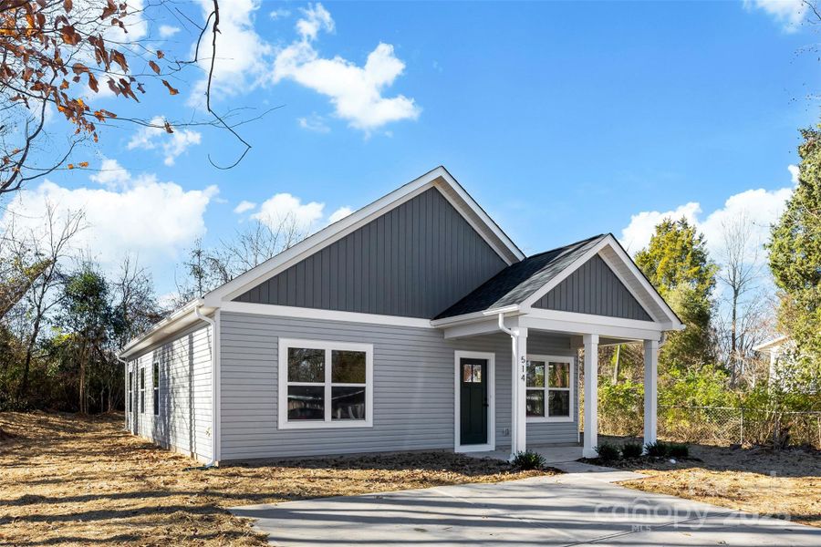 Front exterior of a new home in , East Spencer, NC, highlighting curb appeal (Image 24).