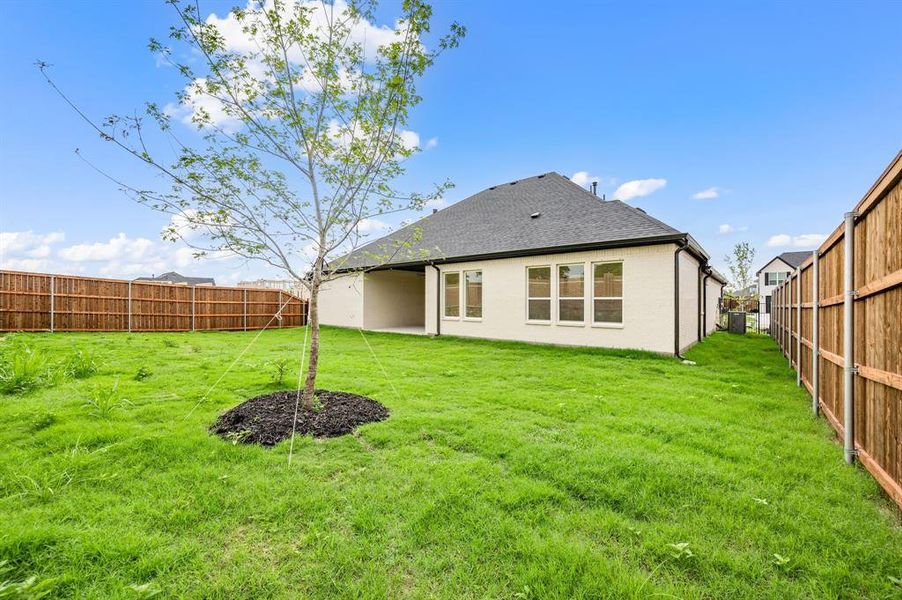 Front exterior of a new home in LeTara, Haslet, TX, highlighting curb appeal (Image 22).