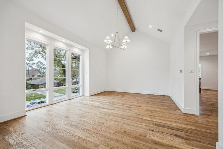 Spacious Primary Suite with Full Length Windows, cathedral ceilings with white Oak Beam, Oak Wood floors, & Designer lighting! Spacious Primary Suite with Full Length Windows, cathedral ceilings with white Oak Beam, Oak Wood floors, & Designer lighting!