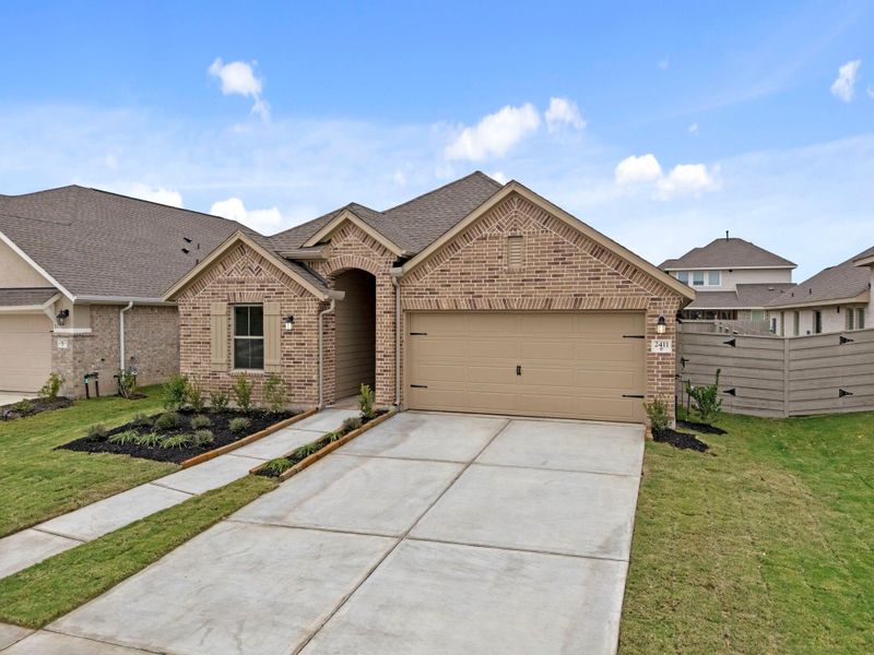 Front exterior of a new home in Pomona 50' & 55', Manvel, TX, highlighting curb appeal (Image 22).