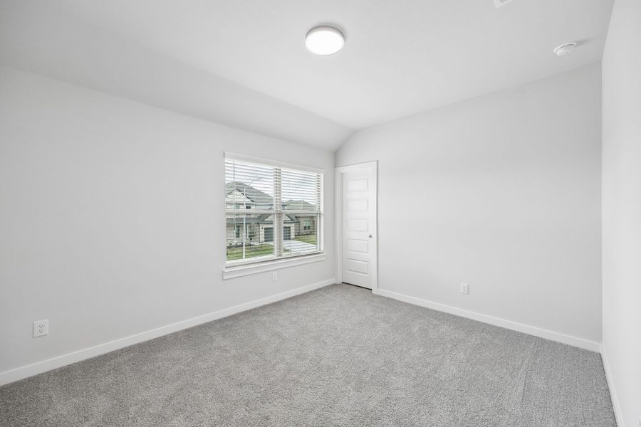 Bedroom in the Winters home plan by Trophy Signature Homes – REPRESENTATIVE PHOTO