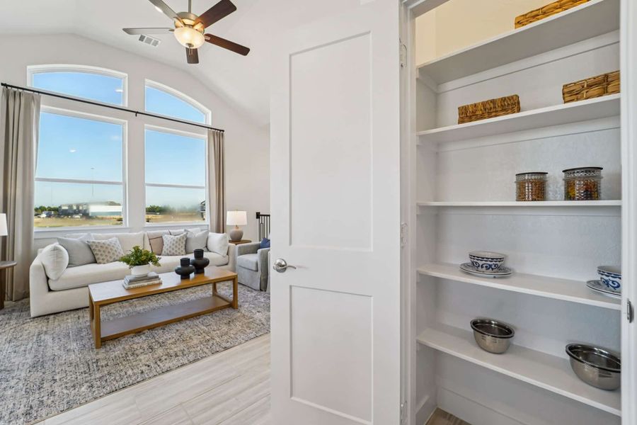 Representative furnished interior of a home built from the Margaux – Chateau Collection by Chesmar Homes in Bridgeland, Cypress (Image 11).