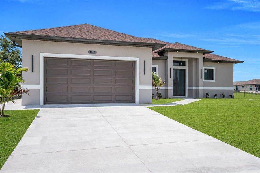 Front exterior of a new home in , Lehigh Acres, FL, highlighting curb appeal (Image 23).