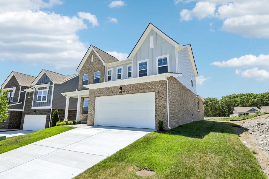 Front exterior of a new home in Cades Bluff, Lebanon, TN, highlighting curb appeal (Image 2). Front exterior of a new home in Cades Bluff, Lebanon, TN, highlighting curb appeal (Image 2).