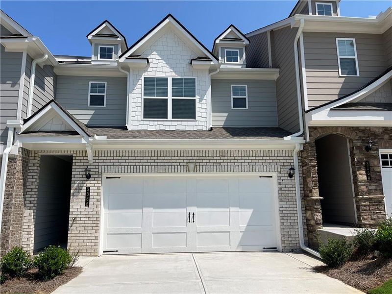 Front exterior of a new home in Porter Reserve, Decatur, GA, highlighting curb appeal (Image 1). Front exterior of a new home in Porter Reserve, Decatur, GA, highlighting curb appeal (Image 1).