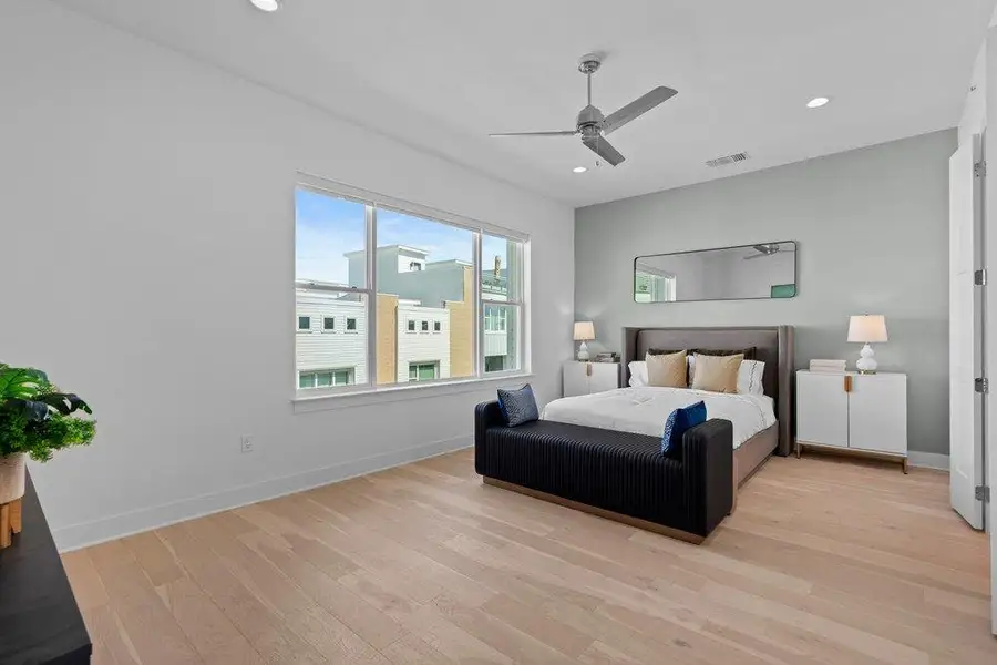 Hardwood floors and massive windows define this peaceful bedroom retreat. Hardwood floors and massive windows define this peaceful bedroom retreat.