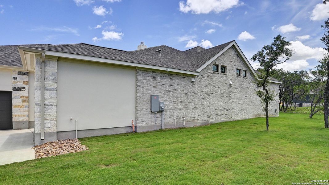 Exterior details and patio area of a home in Megan's Landing 1/2 Acre, Castroville (Image 26). Exterior details and patio area of a home in Megan's Landing 1/2 Acre, Castroville (Image 26).
