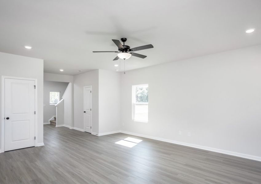 Living room has vinyl plank flooring