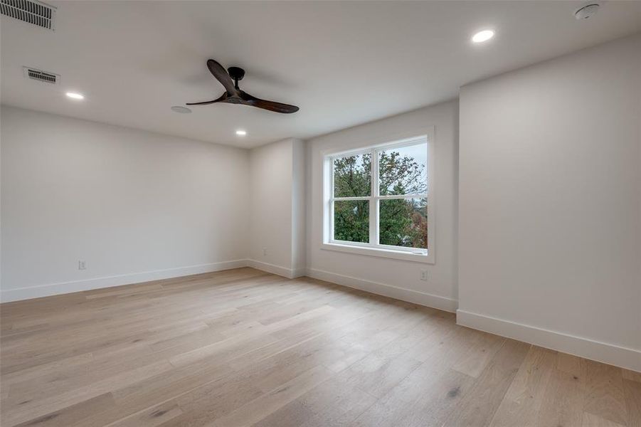 Spare room with light wood-style flooring, recessed lighting, and ceiling fan