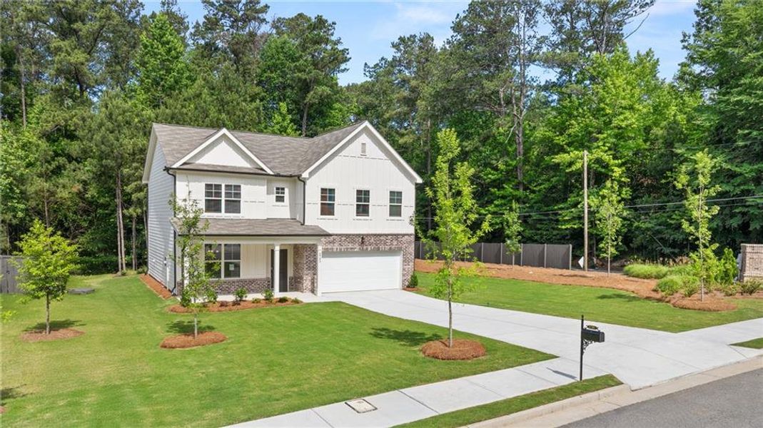 Front exterior of a new home in Whisper Creek, Atlanta, GA, highlighting curb appeal (Image 24). Front exterior of a new home in Whisper Creek, Atlanta, GA, highlighting curb appeal (Image 24).
