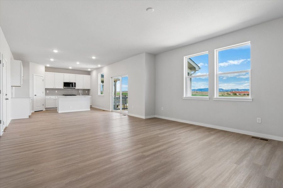 A large empty living room. A large empty living room.