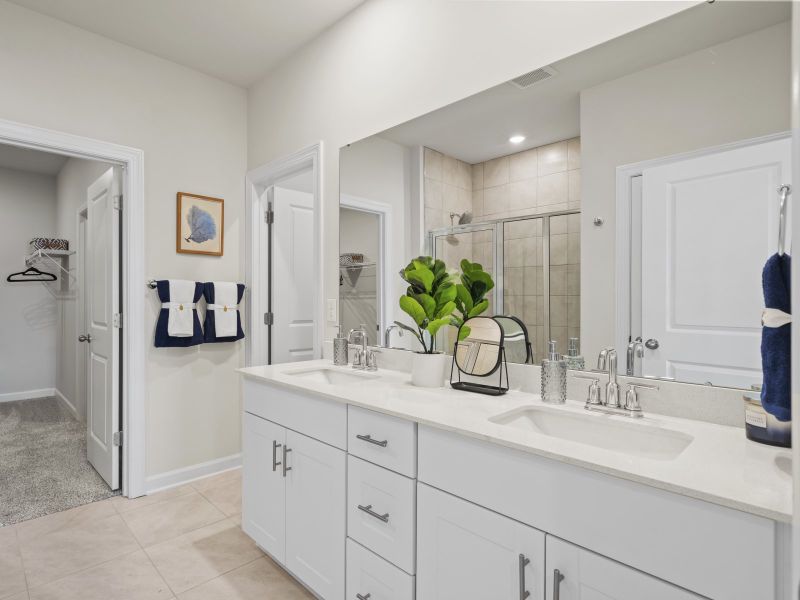 The primary bath offers dual vanity sinks and a walk-in shower (Clear Pond in Myrtle Beach, SC).