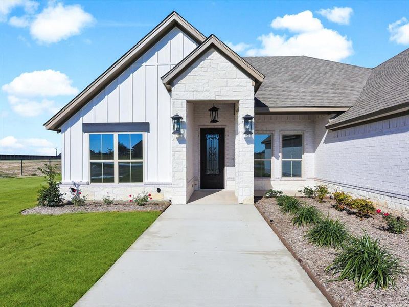 Front exterior of a new home in , Weatherford, TX, highlighting curb appeal (Image 25).