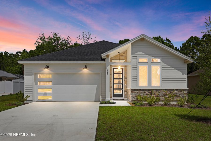 Front exterior of a new home in Palm Coast Homes, Palm Coast, FL, highlighting curb appeal (Image 28).